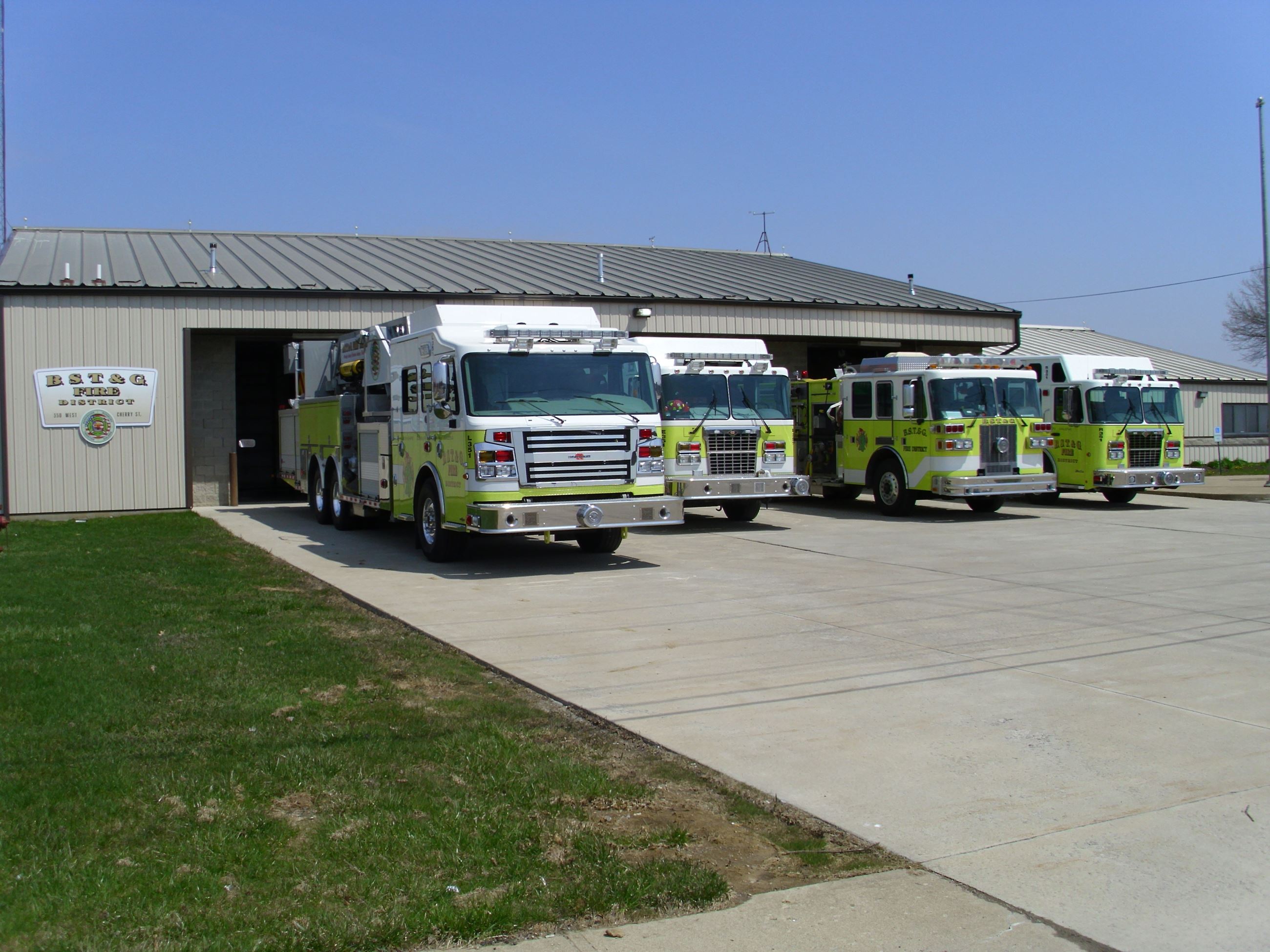 The BSTG Fire Station with four fire trucks lined up outside
